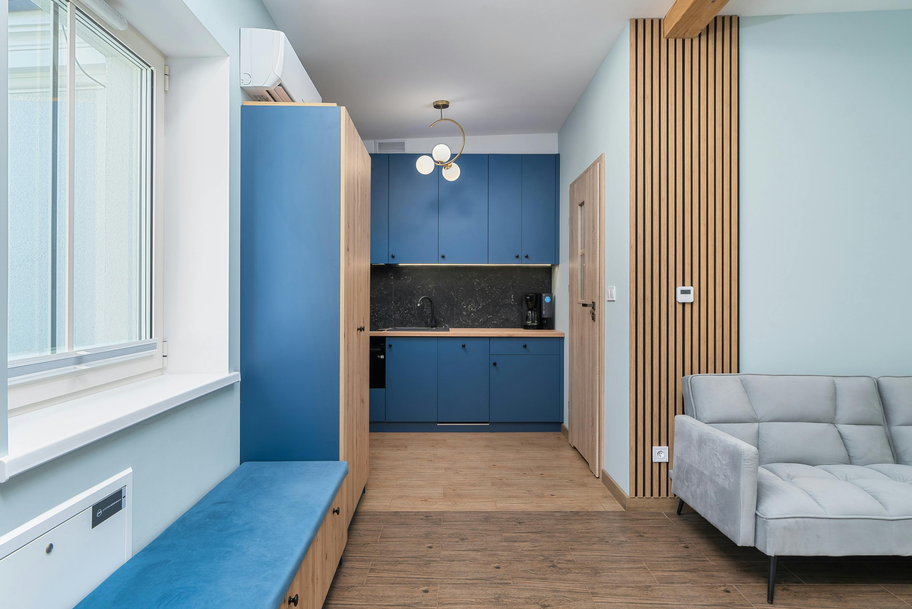 Modern Minimalist Kitchen with Blue Cabinets