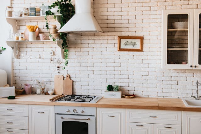 Kitchen with brick wall