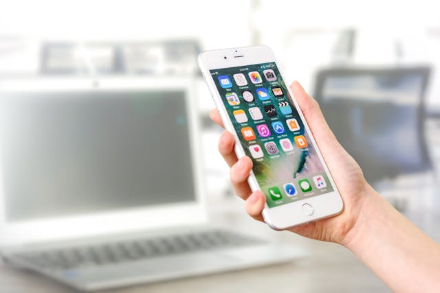 Persons hand holding a cell phone